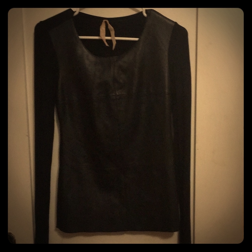 Feels like lamb skin faux leather top.